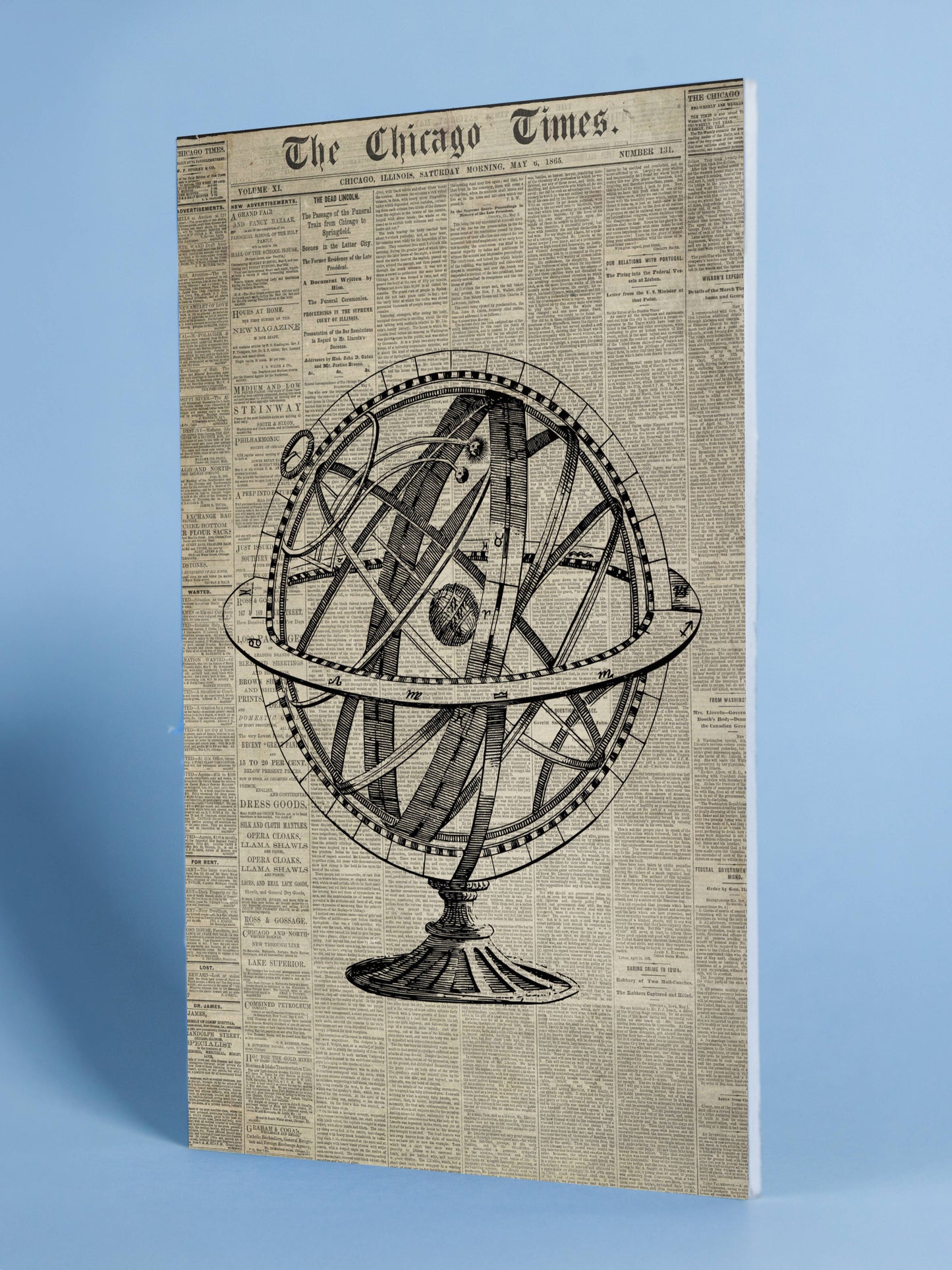 Antique Armillary Sphere with Historic Newspaper